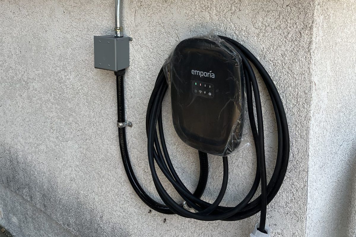 Wall-mounted EV charger fed by exterior conduit at Apperson, Tujunga