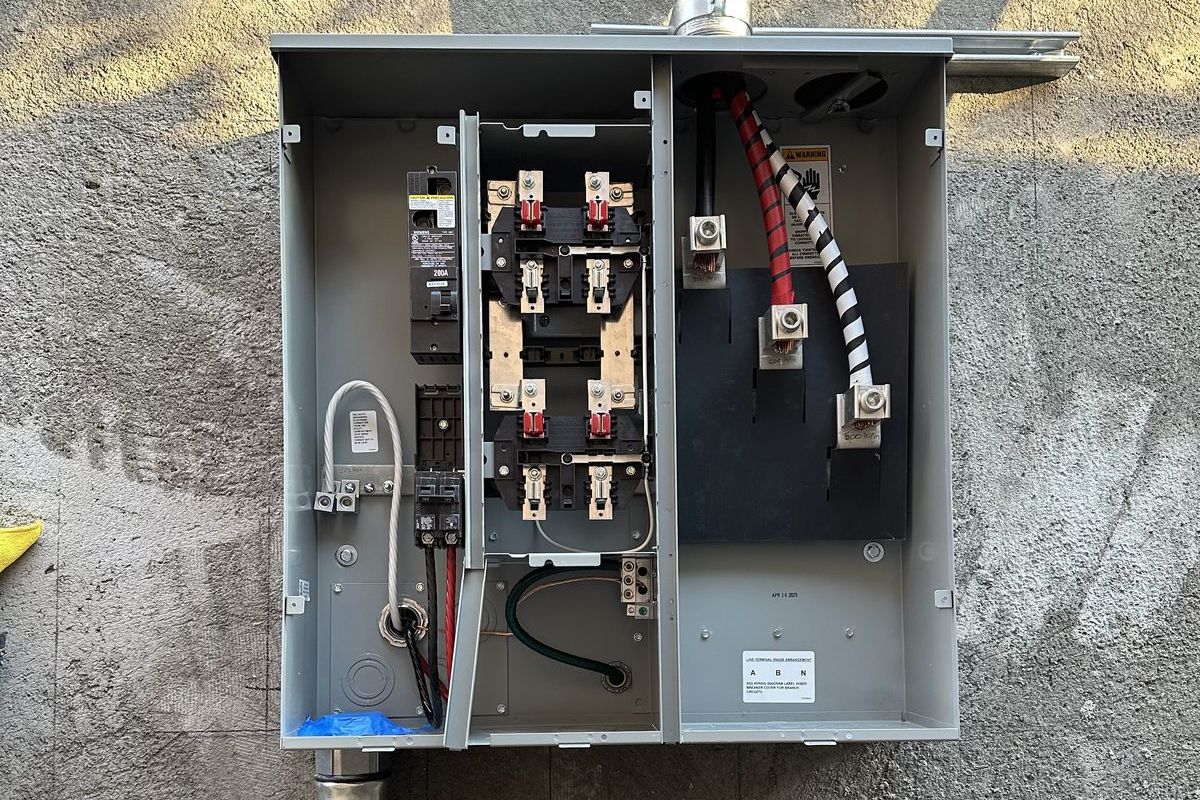 New meter and main panel with rigid conduit at Irving Drive, Burbank