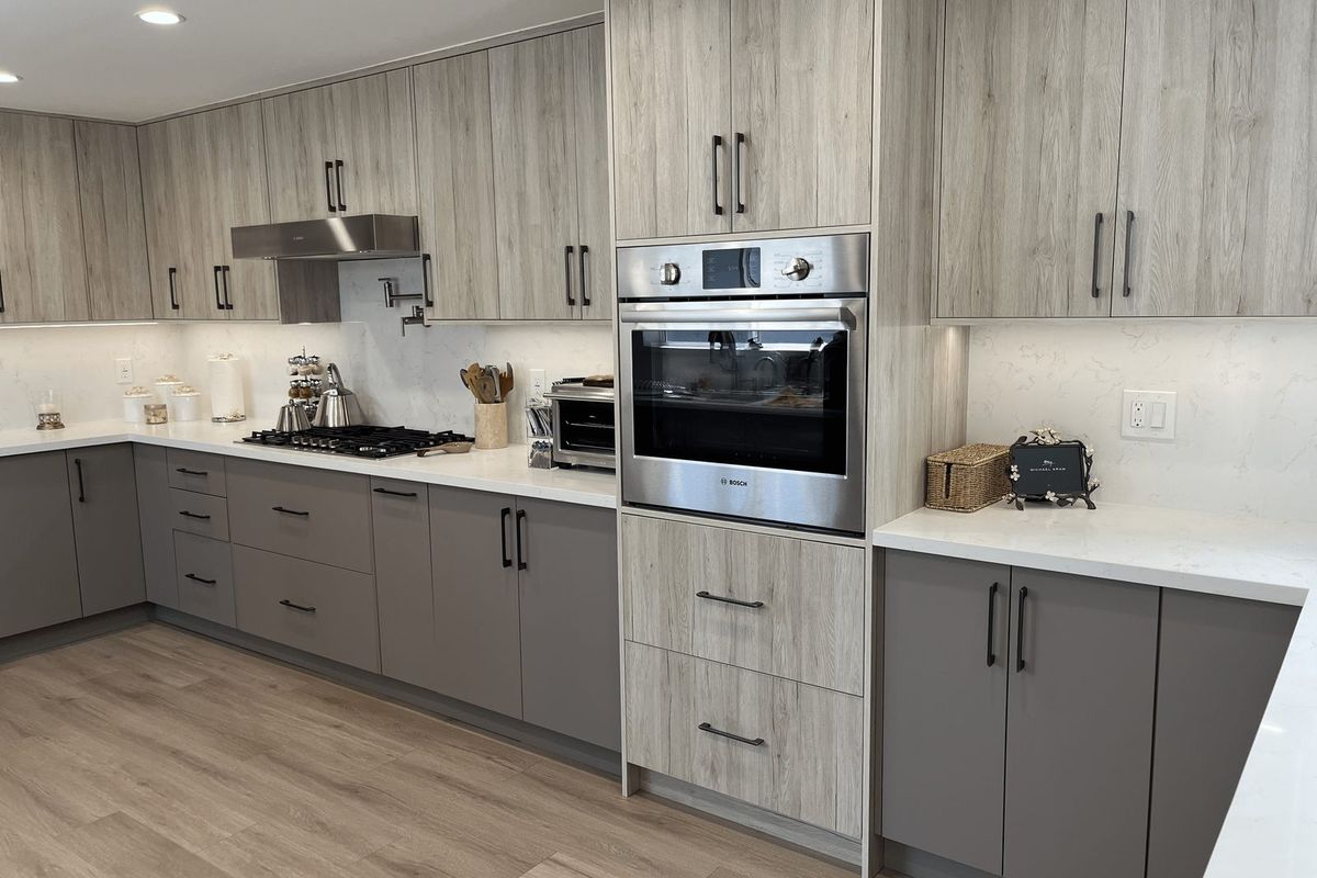 Finished custom kitchen with wall oven, cooktop and under-cabinet lighting at Tujunga Canyon Ln.